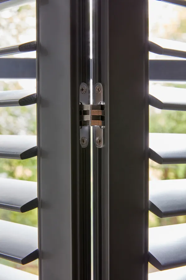 small metal hinge on the Tebbutts grey shutters