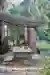 Tebbutts awning hanging over the patio in their garden with benches and a table
